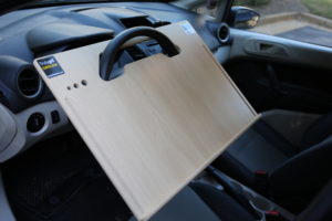 Contractor Wheeldesk mobile desk mounted on a car steering wheel.